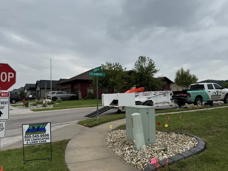ATK Landscaping truck and yard sign at a Black Hills job site