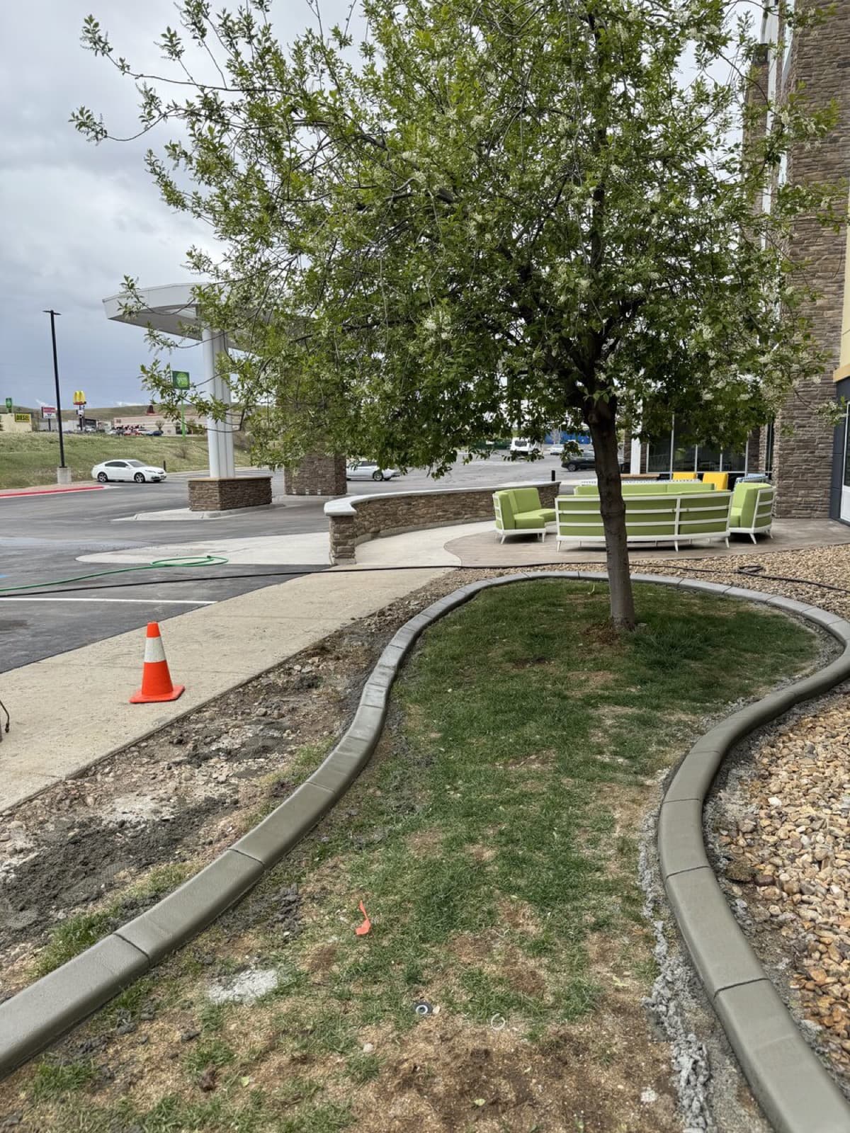 Finished curbing project with clean lines framing a professionally landscaped yard