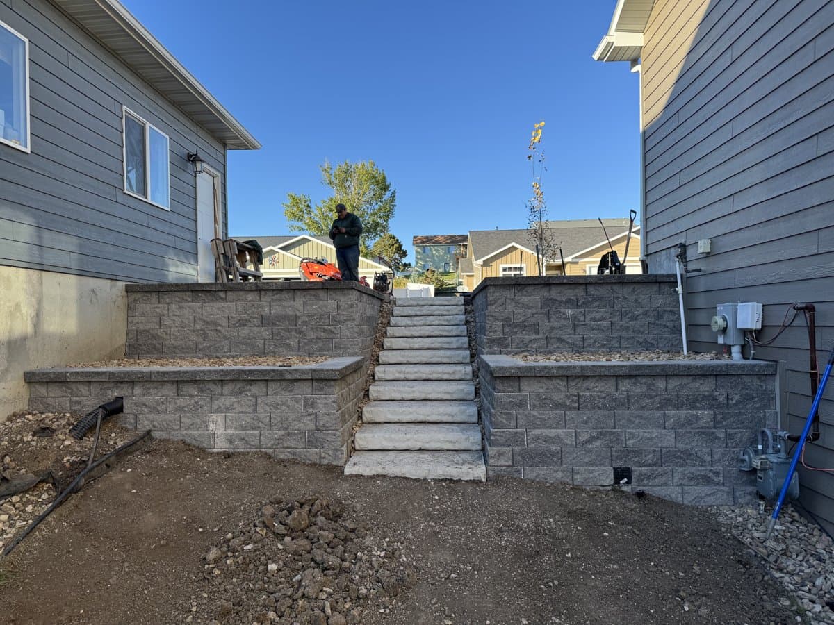 Multi-tier retaining wall construction on a sloped Black Hills property