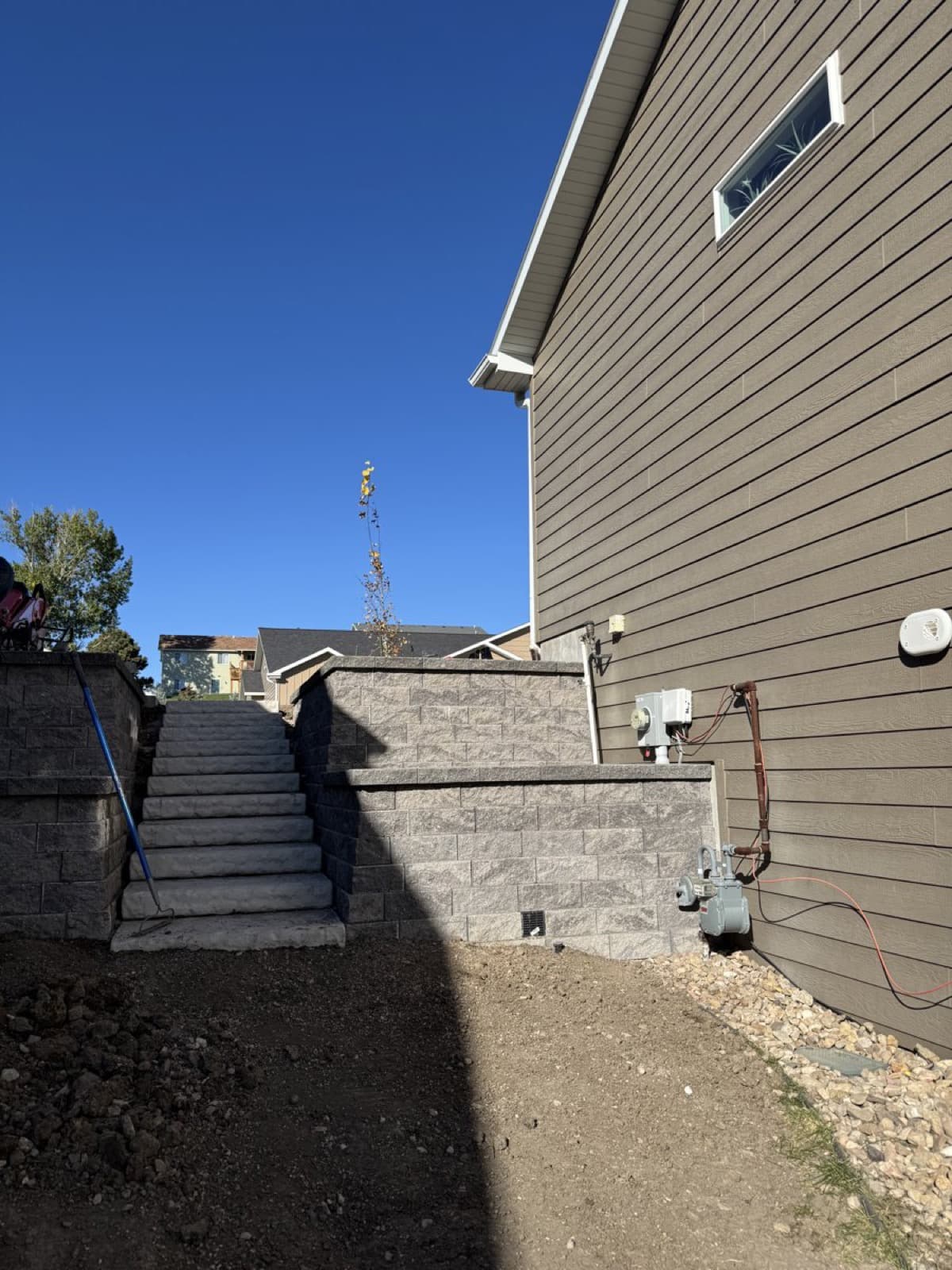 Retaining wall detail showing professional block construction and drainage
