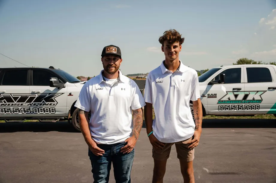 ATK Landscaping team standing in front of work truck in Rapid City, South Dakota