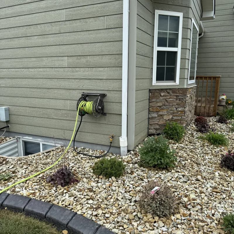 Native rock bed plantings with shrubs and curbing in Black Hills landscaping project